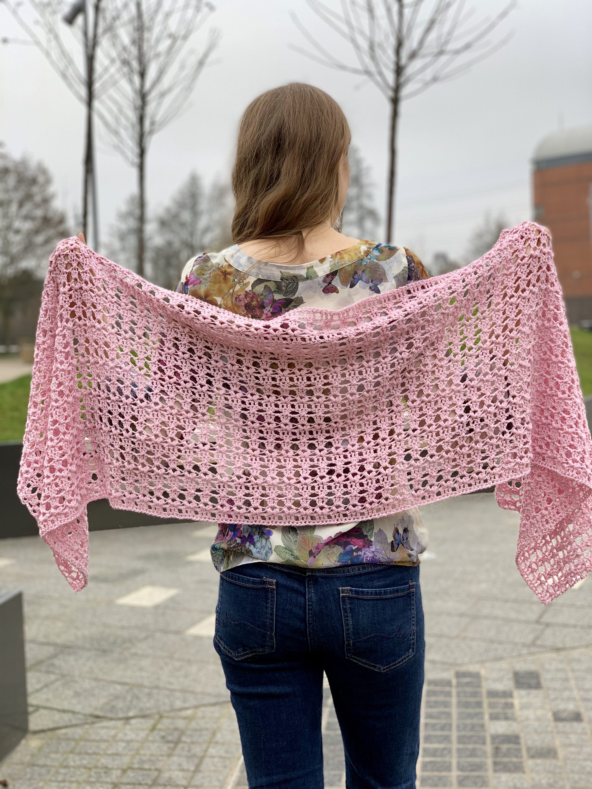https://exquisitecrochetuk.com/wp-content/uploads/2020/08/holding-shawl-at-the-back-building-scaled.jpg